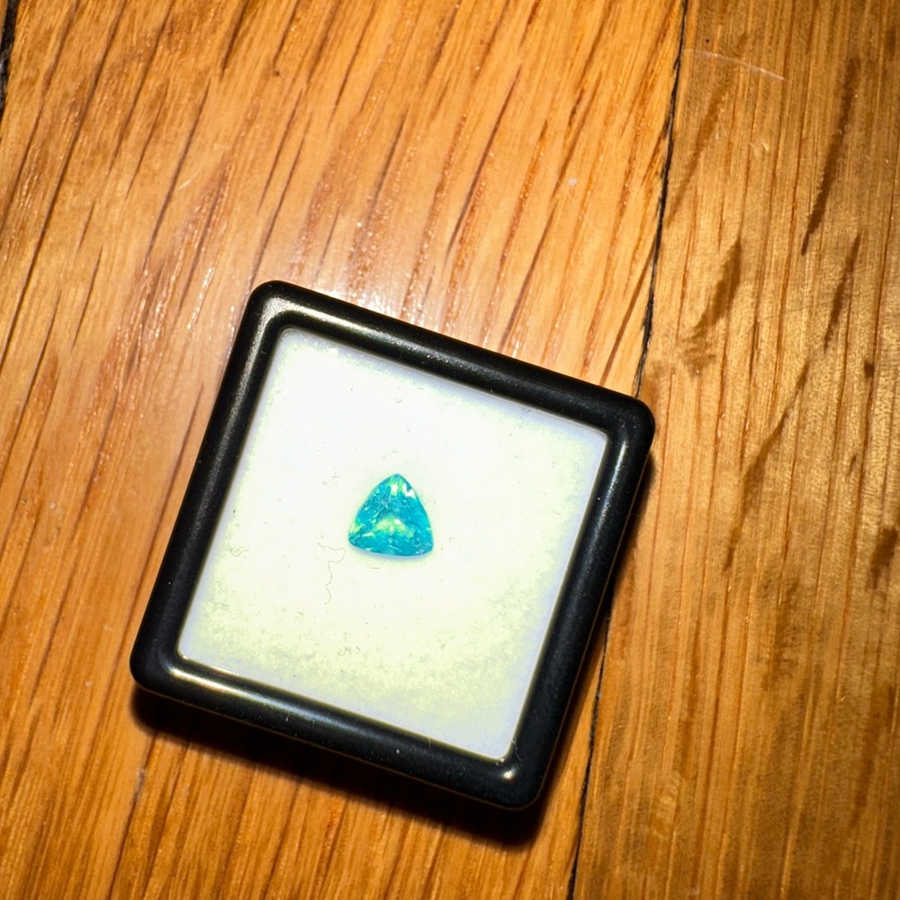 Vibrant Apatite Gemstone in Display Case